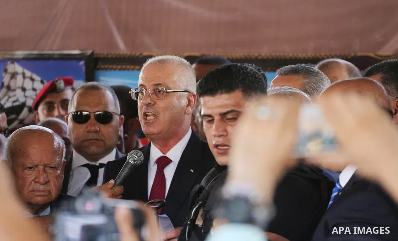 Palestinian Prime Minister Rami Hamdallah makes a statement after his arrival at the Erez border crossing in the northern Gaza Strip on October 2, 2017. Hamdallah is on on his first visit to the Gaza Strip for talks aime...