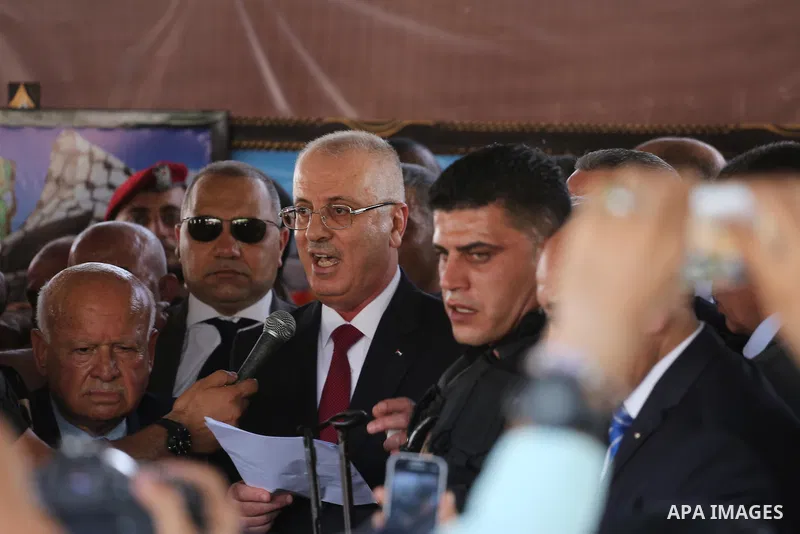 Palestinian Prime Minister Rami Hamdallah makes a statement after his arrival at the Erez border crossing in the northern Gaza Strip on October 2, 2017. Hamdallah is on on his first visit to the Gaza Strip for talks aime...