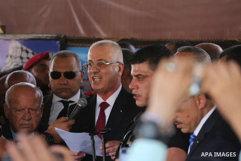 Palestinian Prime Minister Rami Hamdallah makes a statement after his arrival at the Erez border crossing in the northern Gaza Strip on October 2, 2017. Hamdallah is on on his first visit to the Gaza Strip for talks aime...