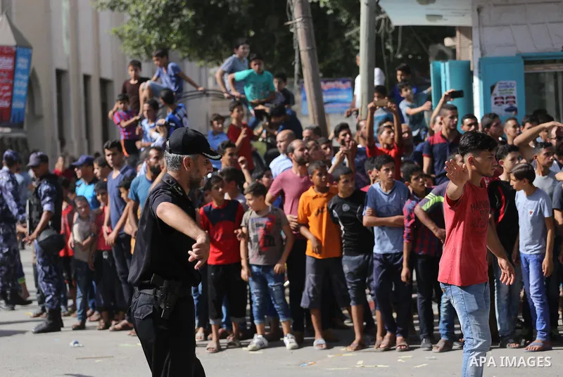 Palestinians celebrate at the Erez border crossing as Palestinian Prime Minister Rami Hamdallah's convoy arrives in the northern Gaza Strip on October 2, 2017. Hamdallah is on on his first visit to the Gaza Strip for tal...