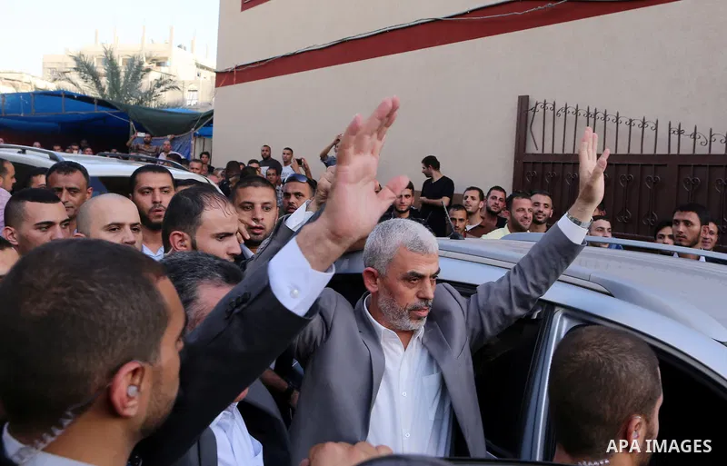 Hamas's leader in the Gaza Strip Yahya Sinwar waves as he arrives for a meeting with Palestinian prime minister and other officials in Gaza City October 2, 2017. Palestinian prime minister Rami Hamdallah arrived in Gaza...