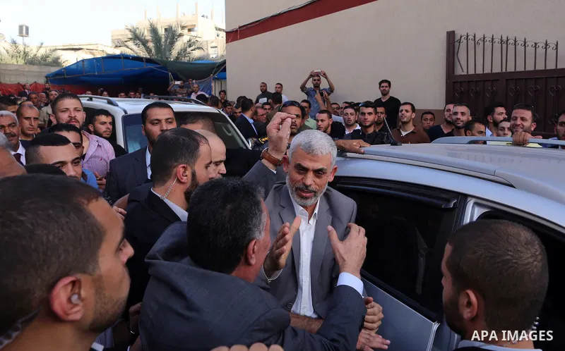 Hamas's leader in the Gaza Strip Yahya Sinwar waves as he arrives for a meeting with Palestinian prime minister and other officials in Gaza City October 2, 2017. Palestinian prime minister Rami Hamdallah arrived in Gaza...