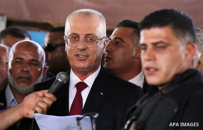 Palestinian Prime Minister Rami Hamdallah makes a statement after his arrival at the Erez border crossing in the northern Gaza Strip on October 2, 2017. Palestinian prime minister Rami Hamdallah arrived in Gaza for his f...