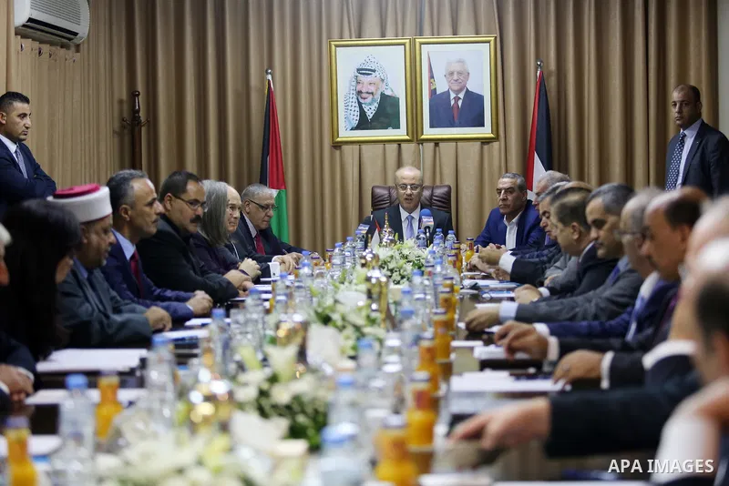 Palestinian Prime Minister Rami Hamdallah chairs a reconciliation government cabinet meeting in Gaza City on October 3, 2017. The Palestinian reconciliation government met in Gaza for the first time since 2014 as moves i...