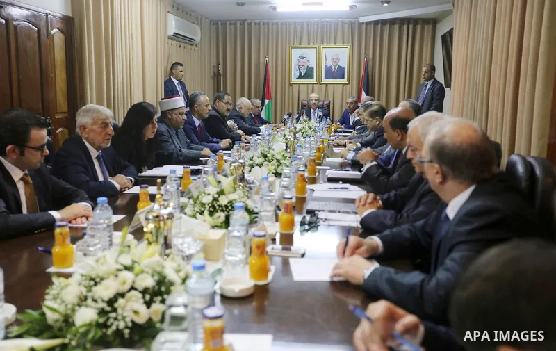 Palestinian Prime Minister Rami Hamdallah chairs a reconciliation government cabinet meeting in Gaza City on October 3, 2017. The Palestinian reconciliation government met in Gaza for the first time since 2014 as moves i...