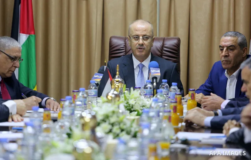 Palestinian Prime Minister Rami Hamdallah chairs a reconciliation government cabinet meeting in Gaza City on October 3, 2017. The Palestinian reconciliation government met in Gaza for the first time since 2014 as moves i...