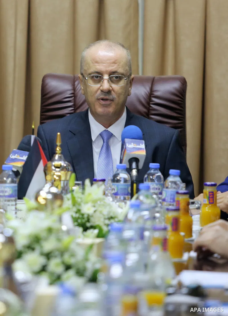 Palestinian Prime Minister Rami Hamdallah chairs a reconciliation government cabinet meeting in Gaza City on October 3, 2017. The Palestinian reconciliation government met in Gaza for the first time since 2014 as moves i...
