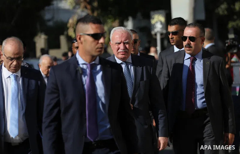 Palestinian Foreign Minister Riad al-Maliki and Palestinian Minister of Transport and Communications Samih Tabila arrive before a reconciliation cabinet meeting in Gaza City on October 3, 2017. The Palestinian reconcilia...
