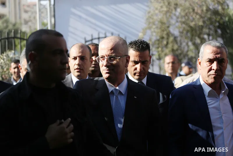 Palestinian Prime Minister Rami Hamdallah arrives before a reconciliation cabinet meeting in Gaza City on October 3, 2017. The Palestinian reconciliation government met in Gaza for the first time since 2014 as moves inte...