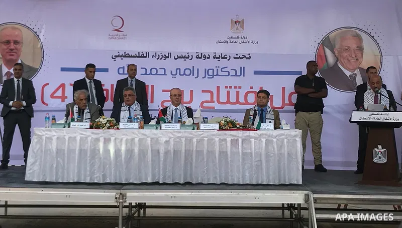 Palestinian Prime Minister Rami Hamdallah attends the opening ceremony of al-Zafer building, which was destroyed during the recent Israeli war on Gaza Strip, in Gaza city on October 3, 2017. Photo by Alaa Sarraj