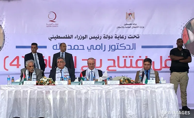 Palestinian Prime Minister Rami Hamdallah attends the opening ceremony of al-Zafer building, which was destroyed during the recent Israeli war on Gaza Strip, in Gaza city on October 3, 2017. Photo by Alaa Sarraj