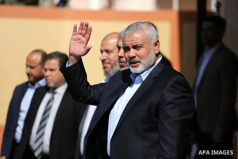 Palestinian Hamas Chief Ismail Haniyeh waves as he and senior Hamas leaders wait for the arrival of Egyptian intelligence Minister Khaled Fawzi in Gaza City October 3, 2017. Photo by Mohammed Asad