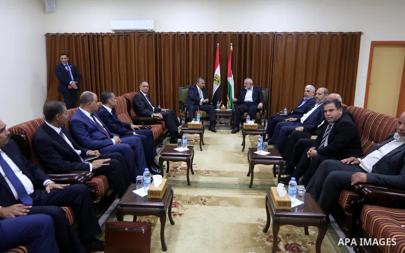 Palestinian Hamas Chief Ismail Haniyeh meets with Egyptian Intelligence Minister Khalid Fawzi at his office in Gaza City on October 3, 2017. Photo by Mohammed Asad