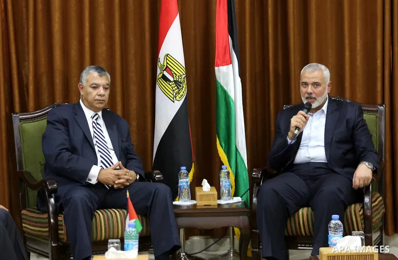 Palestinian Hamas Chief Ismail Haniyeh meets with Egyptian Intelligence Minister Khalid Fawzi at his office in Gaza City on October 3, 2017. Photo by Mohammed Asad