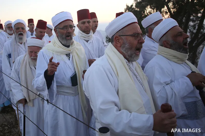 Samaritans pray on top of Mount Gerizim near the northern West Bank city of Nablus on October 4, 2017 during the holiday of Sukkot (Tabernacles) celebrations. Sukkot marks the exodus of the ancient Hebrew people from Egy...