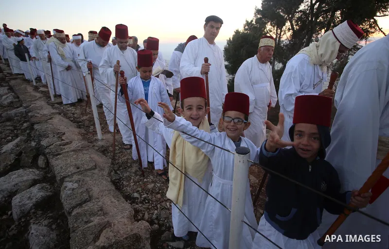 Samaritans pray on top of Mount Gerizim near the northern West Bank city of Nablus on October 4, 2017 during the holiday of Sukkot (Tabernacles) celebrations. Sukkot marks the exodus of the ancient Hebrew people from Egy...