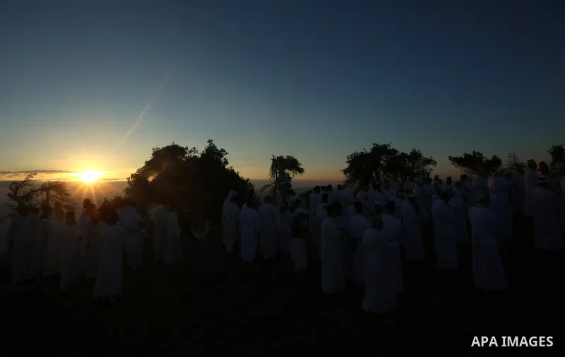 Samaritans pray on top of Mount Gerizim near the northern West Bank city of Nablus on October 4, 2017 during the holiday of Sukkot (Tabernacles) celebrations. Sukkot marks the exodus of the ancient Hebrew people from Egy...