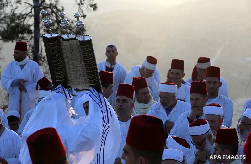 Samaritans pray on top of Mount Gerizim near the northern West Bank city of Nablus on October 4, 2017 during the holiday of Sukkot (Tabernacles) celebrations. Sukkot marks the exodus of the ancient Hebrew people from Egy...