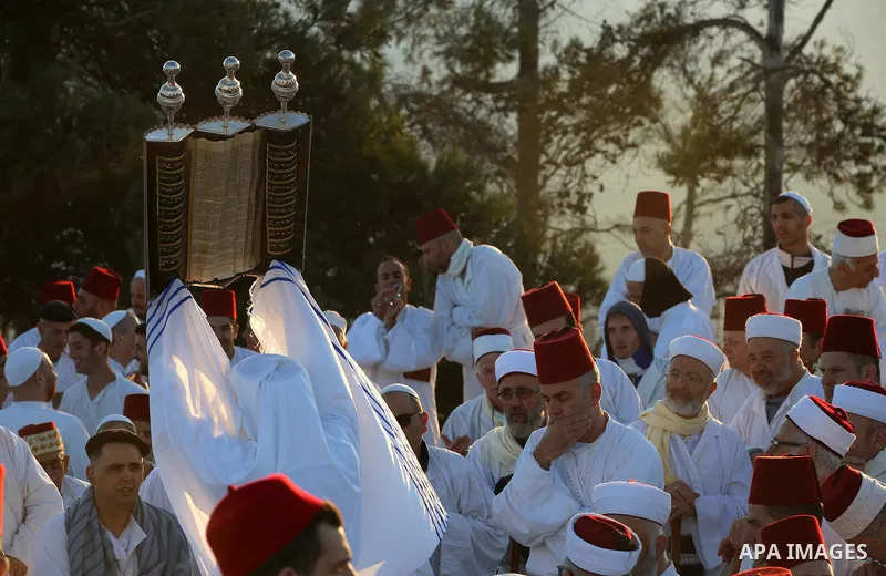 Samaritans pray on top of Mount Gerizim near the northern West Bank city of Nablus on October 4, 2017 during the holiday of Sukkot (Tabernacles) celebrations. Sukkot marks the exodus of the ancient Hebrew people from Egy...