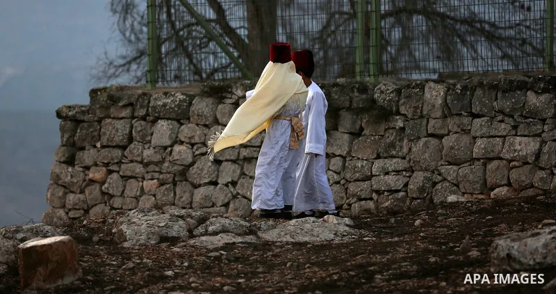 Samaritans pray on top of Mount Gerizim near the northern West Bank city of Nablus on October 4, 2017 during the holiday of Sukkot (Tabernacles) celebrations. Sukkot marks the exodus of the ancient Hebrew people from Egy...