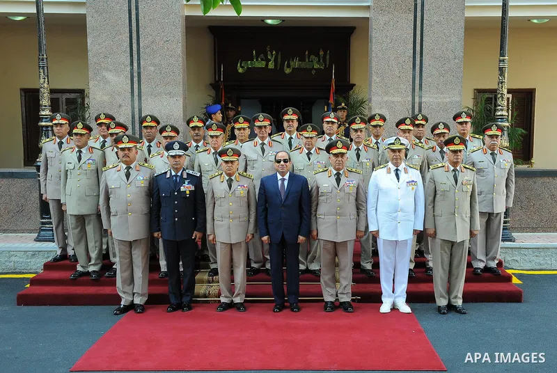 Egyptian President Abdel Fattah al-Sisi poses for a photo with Supreme council of the armed forces following a meeting to mark the 42th anniversary of October War Victory in Cairo, Egypt, on October 4, 2017. Photo by Egy...