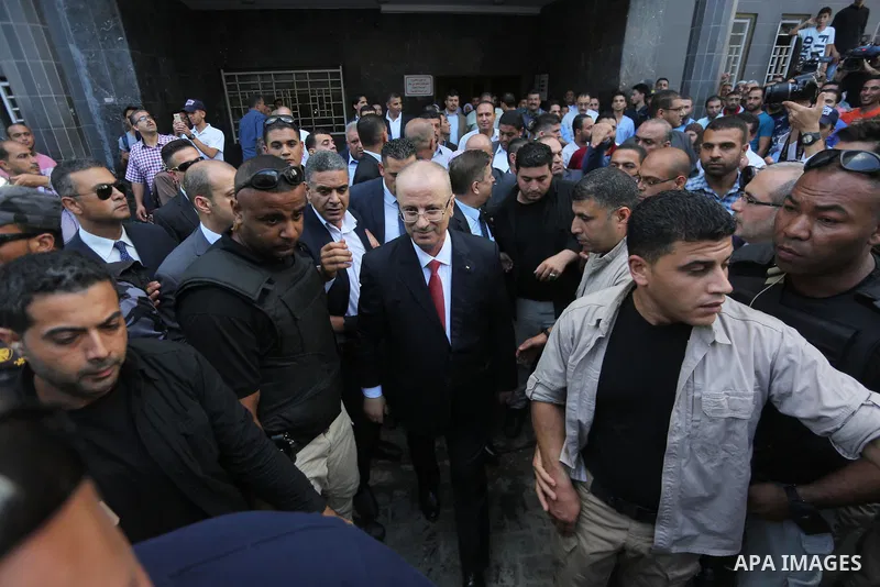 Palestinian prime minister Rami Hamdallah visits patients at Gaza City's Al-Shifa hospital on October 5, 2017. For three days it was all smiles as the Palestinian prime minister held talks in Gaza with Hamas but as the s...