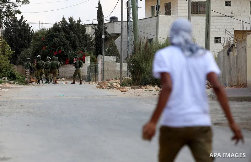 Israeli security forces take position during clashes with Palestinian protesters following a demonstration against the expropriation of Palestinian land by Israel in the village of Kfar Qaddum, near Nablus in the occupie...