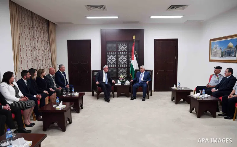Palestinian President Mahmoud Abbas meets with Palestinian delegation that went to Puerto Rico at his headquarter in the West Bank city of Ramallah on October 8, 2017. Photo by Thaer Ganaim