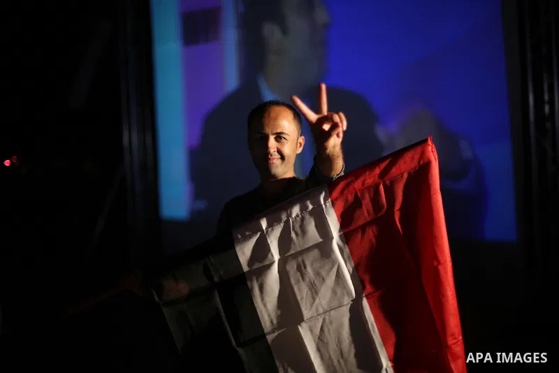 Palestinian fans watch the World Cup 2018 Africa qualifying football match between Egypt and Congo via large screens in Gaza City on October 8, 2017. Photo by Mohammed Asad