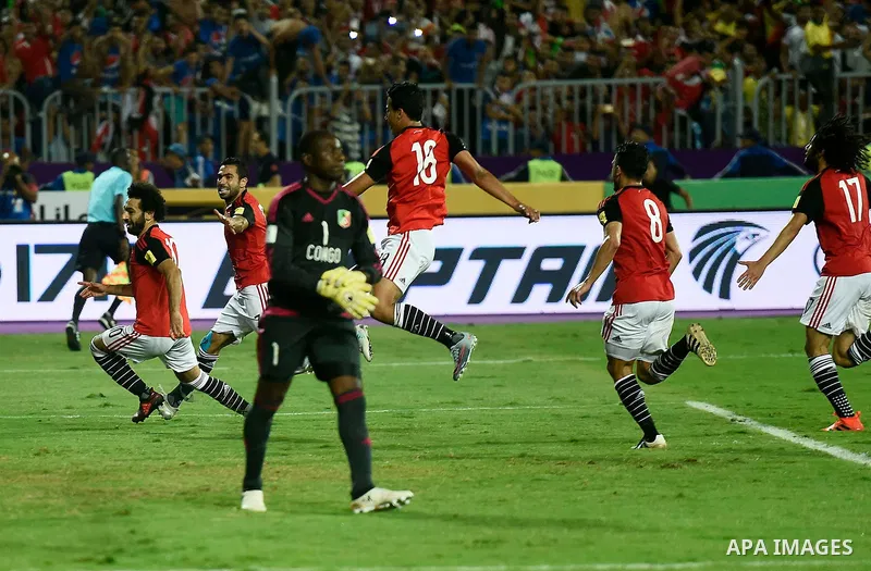 Egypt's team players celebrate wining after the 2018 FIFA World Cup qualification match between Egypt and Congo at the Borg El-Arab Stadium in Alexandria, Egypt, Oct. 8, 2017. Egypt won 2-1 and qualified to the World Cup...