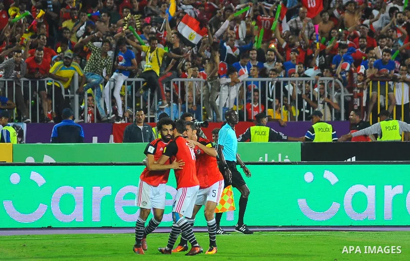 Egypt's team players celebrate wining after the 2018 FIFA World Cup qualification match between Egypt and Congo at the Borg El-Arab Stadium in Alexandria, Egypt, Oct. 8, 2017. Egypt won 2-1 and qualified to the World Cup...
