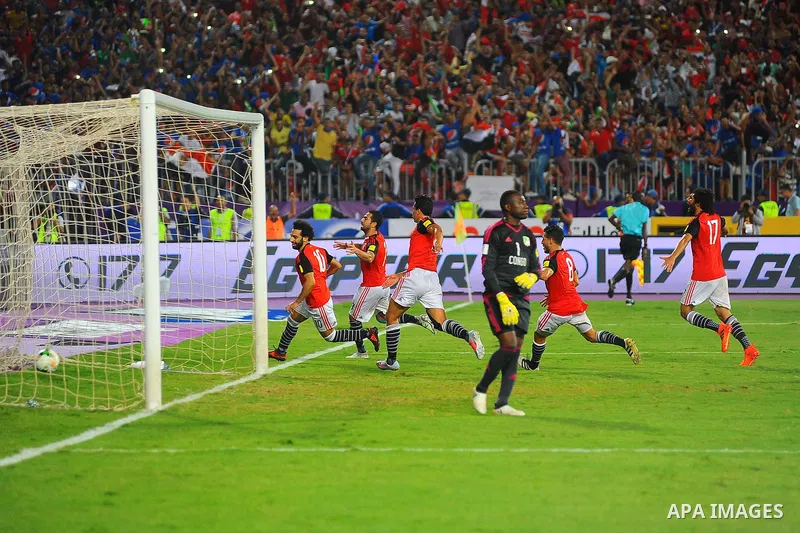 Egypt's team players celebrate wining after the 2018 FIFA World Cup qualification match between Egypt and Congo at the Borg El-Arab Stadium in Alexandria, Egypt, Oct. 8, 2017. Egypt won 2-1 and qualified to the World Cup...