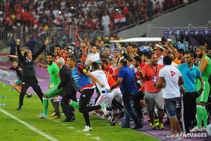 Egypt's team players celebrate wining after the 2018 FIFA World Cup qualification match between Egypt and Congo at the Borg El-Arab Stadium in Alexandria, Egypt, Oct. 8, 2017. Egypt won 2-1 and qualified to the World Cup...