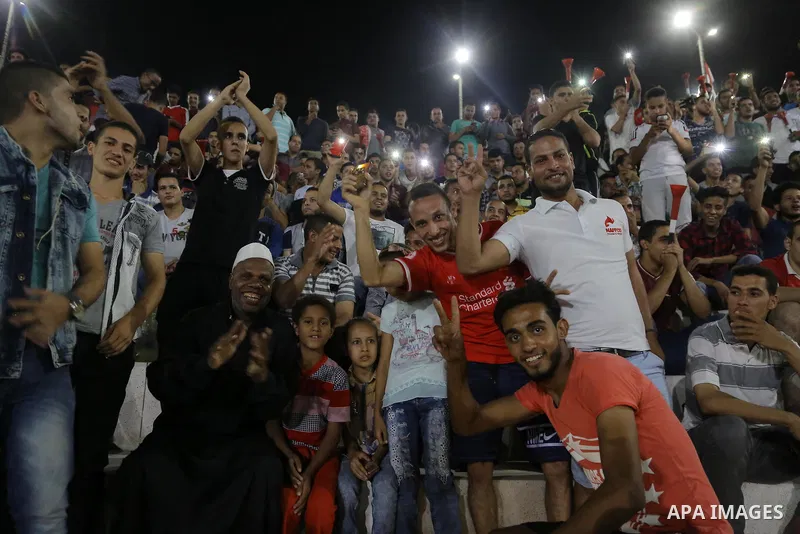 Supporters of Egypt celebrate after the 2018 FIFA World Cup qualification match between Egypt and Congo, in Cairo, Egypt, Oct. 8, 2017. Egypt won 2-1 and qualified to the World Cup finals. Photo by Stringer