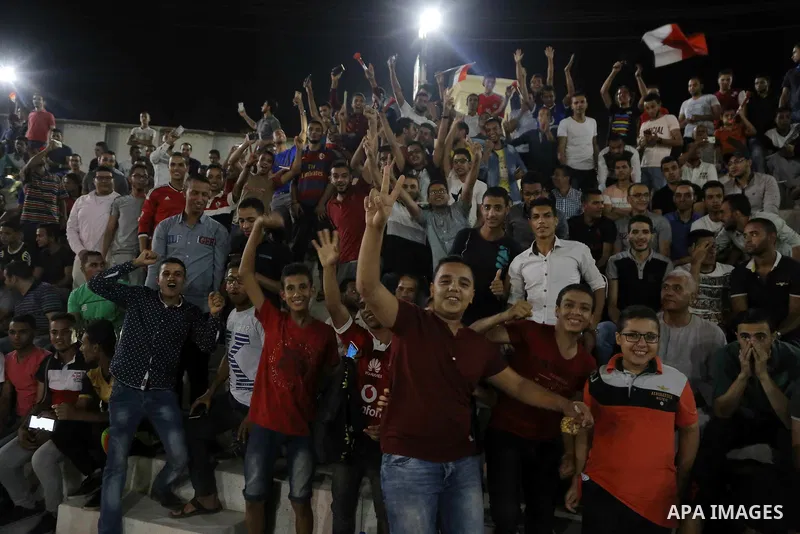 Supporters of Egypt celebrate after the 2018 FIFA World Cup qualification match between Egypt and Congo, in Cairo, Egypt, Oct. 8, 2017. Egypt won 2-1 and qualified to the World Cup finals. Photo by Stringer