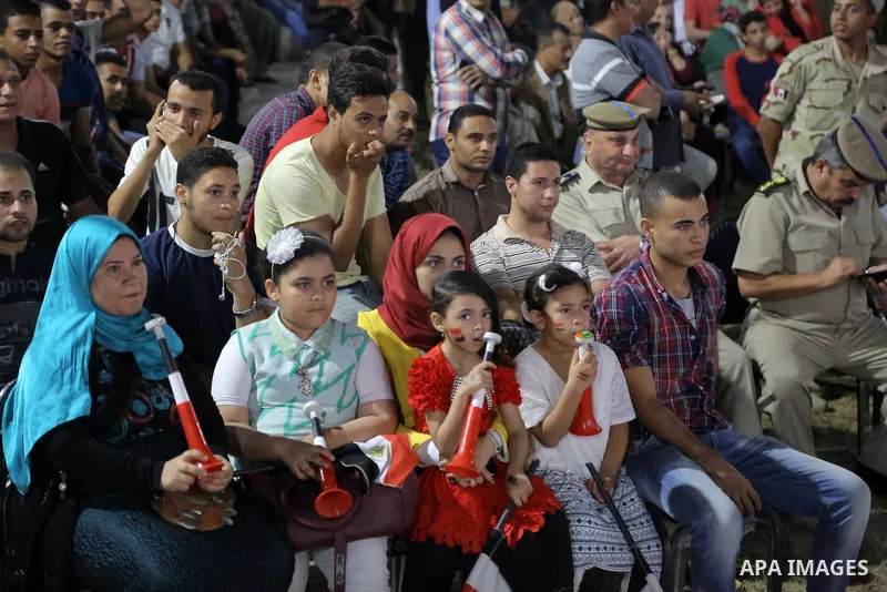 Supporters of Egypt celebrate after the 2018 FIFA World Cup qualification match between Egypt and Congo, in Cairo, Egypt, Oct. 8, 2017. Egypt won 2-1 and qualified to the World Cup finals. Photo by Stringer