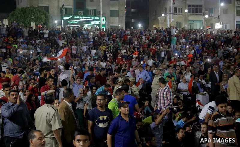 Supporters of Egypt celebrate after the 2018 FIFA World Cup qualification match between Egypt and Congo, in Cairo, Egypt, Oct. 8, 2017. Egypt won 2-1 and qualified to the World Cup finals. Photo by Stringer
