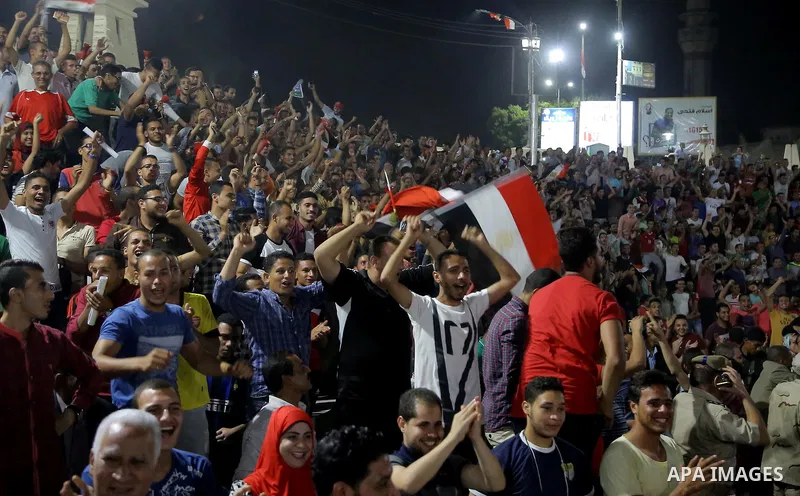 Supporters of Egypt celebrate after the 2018 FIFA World Cup qualification match between Egypt and Congo, in Cairo, Egypt, Oct. 8, 2017. Egypt won 2-1 and qualified to the World Cup finals. Photo by Stringer