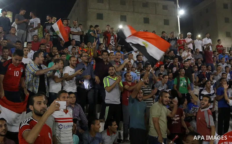 Supporters of Egypt celebrate after the 2018 FIFA World Cup qualification match between Egypt and Congo, in Cairo, Egypt, Oct. 8, 2017. Egypt won 2-1 and qualified to the World Cup finals. Photo by Stringer