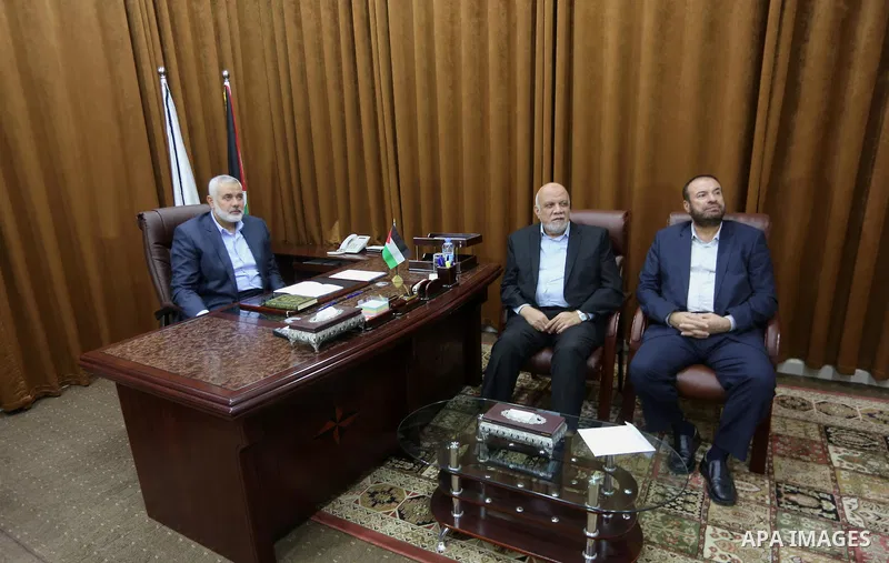 Hamas Chief Ismail Haniyeh watches a TV broadcast of a deal signing between Hamas and Fatah in Cairo, at his office in Gaza City October 12, 2017. Rival Palestinian factions Hamas and Fatah have reached agreement on aspe...