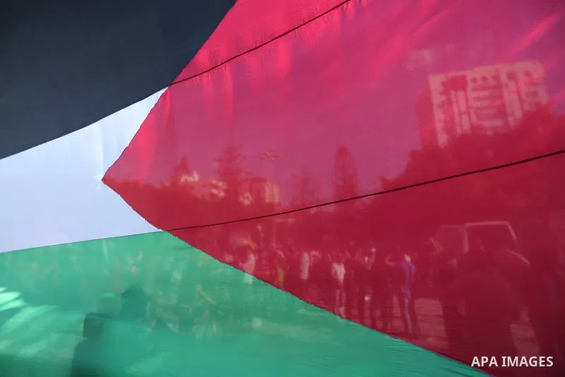 Palestinians wave the flags of Egypt, Palestine, Fatah and Hamas as they gather in Gaza City to celebrate after rival Palestinian factions Hamas and Fatah reached an agreement on ending a decade-long split following talk...