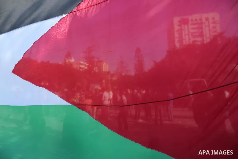 Palestinians wave the flags of Egypt, Palestine, Fatah and Hamas as they gather in Gaza City to celebrate after rival Palestinian factions Hamas and Fatah reached an agreement on ending a decade-long split following talk...