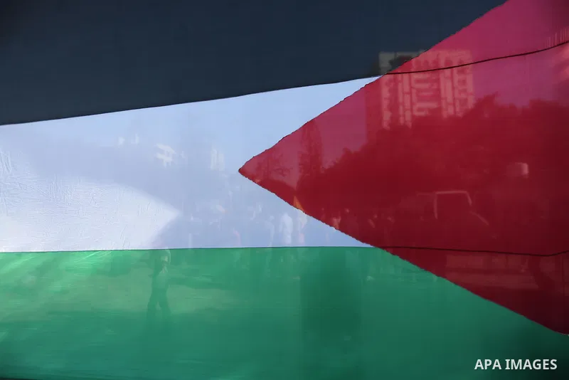 Palestinians wave the flags of Egypt, Palestine, Fatah and Hamas as they gather in Gaza City to celebrate after rival Palestinian factions Hamas and Fatah reached an agreement on ending a decade-long split following talk...