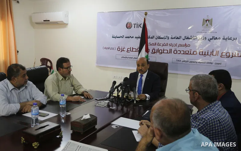 Palestinian housing minister Mufeed al-Hasayna attends the signing of housing project funded by Turkish Cooperation and Coordination Agency "TİKA", in Gaza city on October 15, 2017. Photo by Mohammed Asad