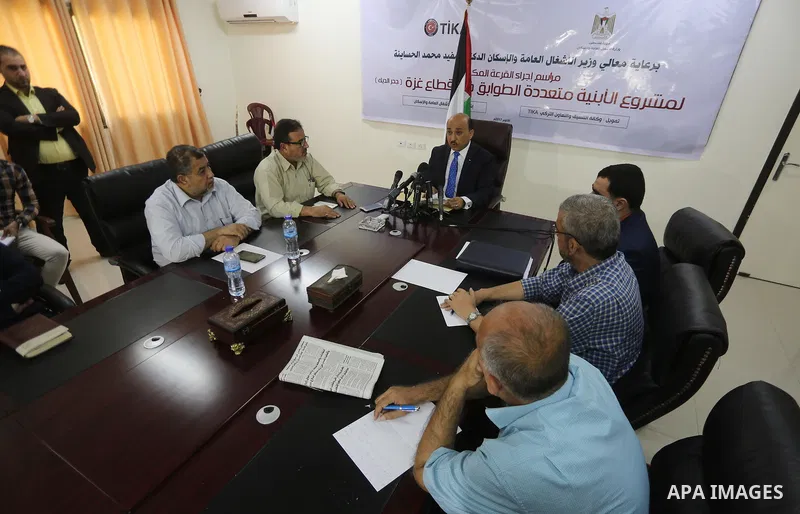 Palestinian housing minister Mufeed al-Hasayna attends the signing of housing project funded by Turkish Cooperation and Coordination Agency "TİKA", in Gaza city on October 15, 2017. Photo by Mohammed Asad