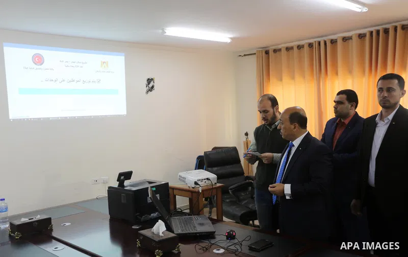 Palestinian housing minister Mufeed al-Hasayna attends the signing of housing project funded by Turkish Cooperation and Coordination Agency "TİKA", in Gaza city on October 15, 2017. Photo by Mohammed Asad