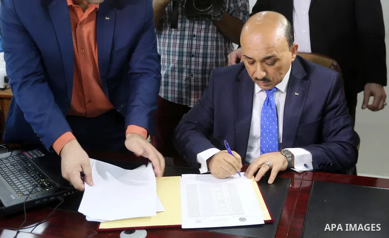 Palestinian housing minister Mufeed al-Hasayna attends the signing of housing project funded by Turkish Cooperation and Coordination Agency "TİKA", in Gaza city on October 15, 2017. Photo by Mohammed Asad