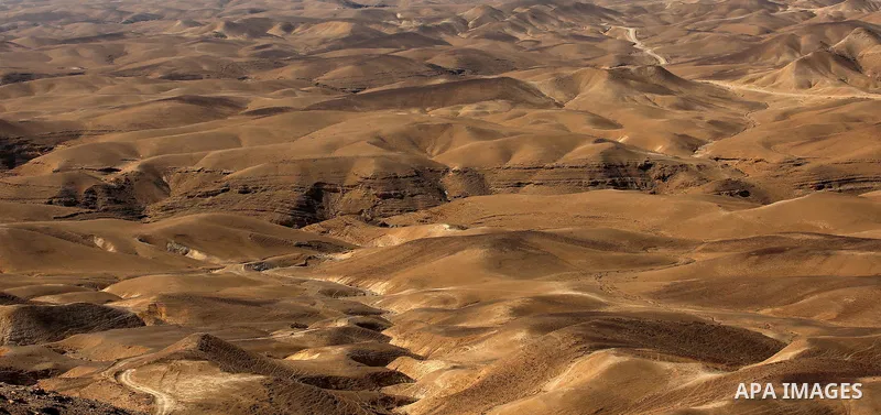 A picture taken on October 13, 2017 shows a series of limestone rocks in the Jerusalem wilderness (Wadi Ghar), in the east of the West Bank city of Bethlehem. Photo by Ayman Ameen