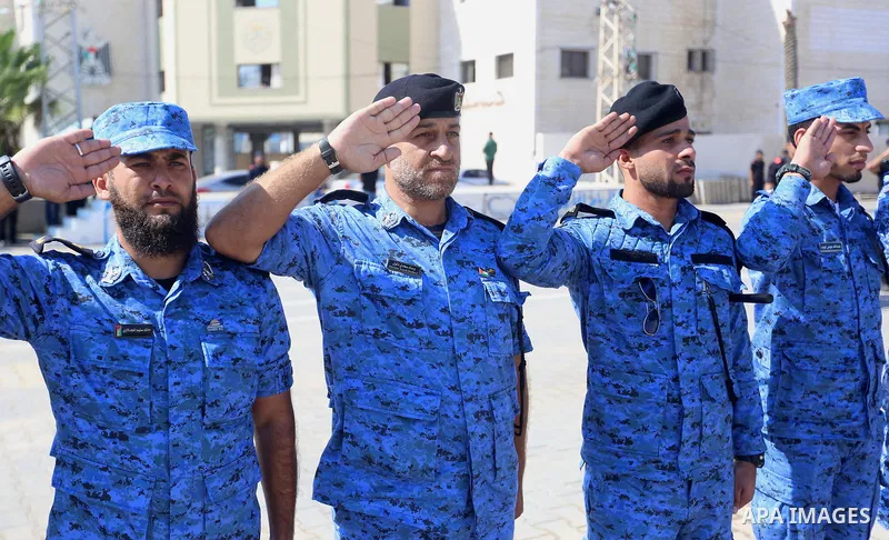 Palestinian students show off their military skills during a graduation ceremony from Ribat University College, in Gaza City, On October 16, 2017. Photo by Atia Darwish