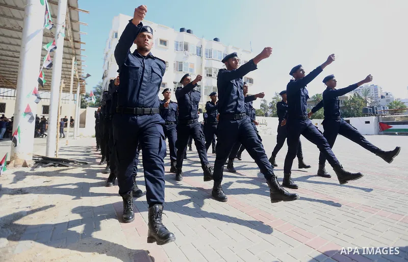 Palestinian students show off their military skills during a graduation ceremony from Ribat University College, in Gaza City, On October 16, 2017. Photo by Atia Darwish